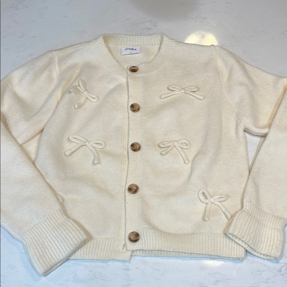 Storia Ivory Bow Cardigan